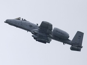 An A-10 Thunderbolt from the 107th Fighter Squadron out of Selfridge Air National Guard Base performs a fly-by along the Detroit River to kick-off the GM River Days, Friday, June 22, 2018.
