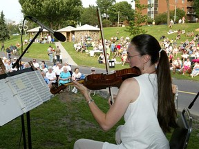 Violinist Michele Dumoulin performing as part of the Windsor Symphony Orchestra's summer concert series on the riverfront.