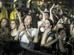 Fans fill Place des Festivals to watch Jessie Reyez perform at a free outdoor show at the Montreal International Jazz Festival in Montreal on July 3, 2018.