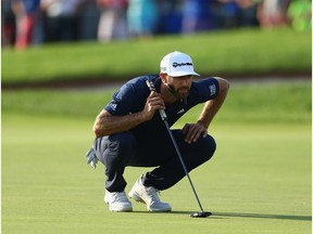 Dustin Johnson lines up a putt on the 18th hole during the final round at the RBC Canadian Open at Glen Abbey Golf Club on July 29, 2018 in Oakville, Canada.