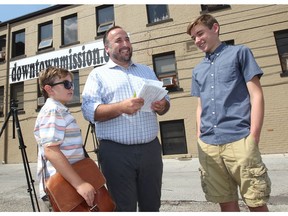 City Coun. Rino Bortolin with sons, Wilson, 8, and Charlie, 13, during Bortolin's press conference held outside the Downtown Mission on July 25, 2018.