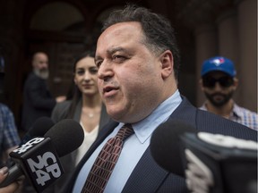Lawyer Domenic Basile speaks outside of Old City Hall on behalf of accused Toronto Blue Jays pitcher Roberto Osuna in Toronto on June 18, 2018. The 23-year-old pitcher was charged with one count of assault by Toronto police early last month. He was placed on administrative leave by Major League Baseball, in accordance with the league's domestic violence policy.