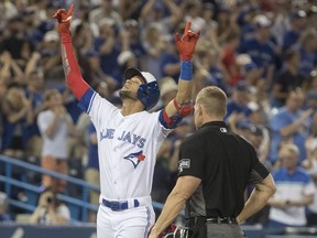 Toronto Blue Jays' Lourdes Gurriel Jr. reacts as he crosses home plate after hitting a two-run home run against the New York Mets in the eighth inning of their interleague MLB baseball game in Toronto on Tuesday, July 3, 2018.