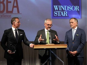 Brian Schwab, Stephen Savage and John Savage (left to right) from Cypher Systems Group accept the Believe Windsor Essex Award during the 2016 BEA Awards at Caesars Windsor on April 20, 2016.