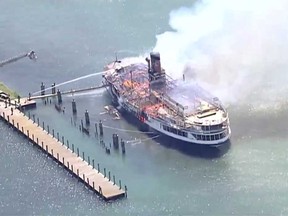 An image from a video broadcast live by WDIV Local 4 Detroit on July 6, 2018, showing a Boblo Island ferry in flames.