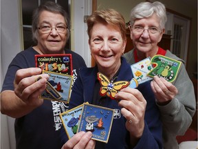 In this Nov. 15, 2017, file photo, Caralle Hicks, left, Kathi Poupard and Ruth Wass are shown with memorabilia from the Camp Bryerswood. The trio have been involved in the local Girl Scout organization for many years and are trying to prevent the closure of the camp.