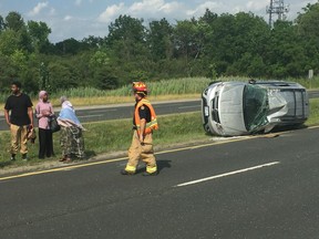 Police and other emergency crews responded after reports of a vehicle travelling on Dougall Parkway on July 5, 2018, crossed the median and slammed into an oncoming vehicle.

Bona Mohammed, 22, and some of his family members assess the wreckage of his mother¹s car Thursday, July 5, 2018, after a two-vehicle crash on Dougall Parkway. Mohammed said he was on his way home from work when an oncoming car crossed the median, hit the vehicle he was driving and caused it to flip over several times. Mohammed said he escaped with only a small scratch on his wrists. The condition of the other driver was unknown. (TREVOR WILHELM/Windsor Star)