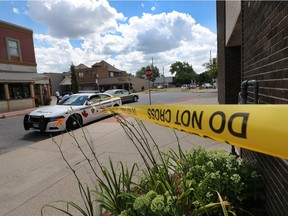 Police tape was used to block off a section of sidewalk on Erie Street at Elsmere Avenue on July 17, 2018. Police were investigating an assault in front of the Gualta Apartments.