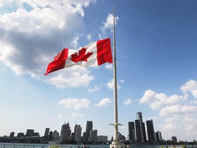 The Great Canadian Flag flies at half-staff in downtown Windsor on July 25, 2018 in honour of FCA CEO Sergio Marchionne who died earlier in the day.