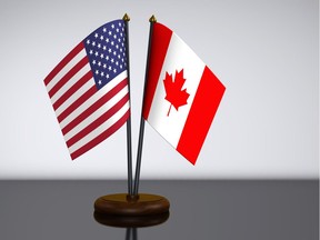 U.S. and Canadian desk flags are shown in this photo illustration.