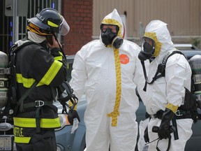 In this July 31, 2018, file photo, Windsor firefighter confers with hazardous materials experts with Windsor police about a powdery substance found in a vehicle in the 3600 block of Sandwich Street. The powder is suspected to be fentanyl and two adults were hospitalized.