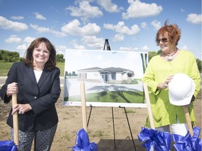 Carol Derbyshire, left, executive director of The Hospice of Windsor and Essex County, and Joan McSweeney, a member of the board of directors for Hospice, are shown July 18, 2018, next to an illustration of the future training and welcome centre at Hospice Erie Shores campus in Leamington.