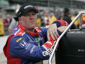 In this May 9, 2009 file photo, Paul Tracy, of Canada, watches as he is bumped from the provisional starting field for the Indianapolis 500 auto race. Tracy wants drivers to get a little nastier. Back when he was racing, Tracy was famously involved in dustups, notably with fellow drivers Alex Tagliani and Sebastien Bourdais, going so far as to criticize them for keeping their helmets on during confrontations.