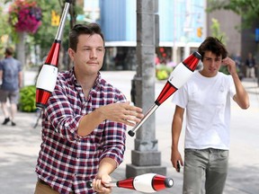 Professional busker Jay Henderson, a.k.a. Kobbler Jay, a.k.a. Seb Whipits, shows off his juggling skills in downtown Windsor on July 30, 2018. Henderson is one of the organizers of Buskerville 2018, which takes place in Walkerville Aug. 10-12.