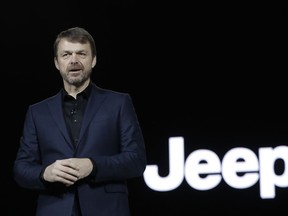 FILE - In this file photo dated Tuesday, Jan. 16, 2018, Mike Manley, head of Jeep Brand, introduces the 2019 Jeep Cherokee during the North American International Auto Show, in Detroit, USA. Fiat Chrysler's board on Saturday July 20, 2018, has recommended Jeep executive Mike Manley to replace seriously ill CEO Sergio Marchionne.