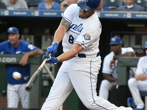 Kansas City Royals' Mike Moustakas hits a two-run home run during the first inning of the team's baseball game against the Detroit Tigers on Tuesday, July 24, 2018, in Kansas City, Mo.