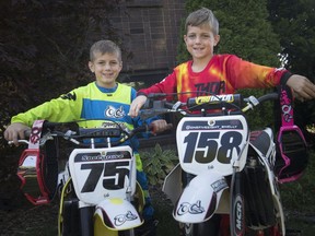 Ryder Snelgrove, 6, and his brother, Nathan Snelgrove, 9, who qualified for the Rocky Mountain ATV/MC AMA nationals, to be held at the Loretta Lynn Ranch in Tennessee, are pictured with their bikes outside their house in Essex on July 19, 2018.