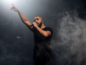 In this June 27, 2015, file photo, Canadian singer Drake performs on the main stage at Wireless festival in Finsbury Park, London. All 25 tracks from Drake's ultra-popular "Scorpion" album, released on June 29, are on the Billboard Hot 100 chart.