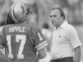 Detroit Lions coach Darryl Rogers, right, talks to quarterback Eric Hipple during an NFL football game, date not known. Rogers, who coached Michigan State to a share of the Big Ten title in 1978 and later took the helm for the Lions, has died. He was 83. The Lions said Rogers' family confirmed his death on Wednesday, July 11, 2018.