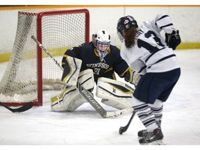 University of Windsor goaltender Morgan Farrow makes a save during OUA women's hockey against the University of Toronto at South Windsor Arena on January 4, 2017 in Windsor, Ontario.