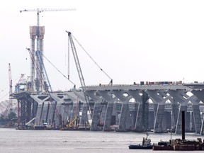 Construction cranes on the construction site of the new Champlain bridge in Montreal are shown on June 18, 2018.