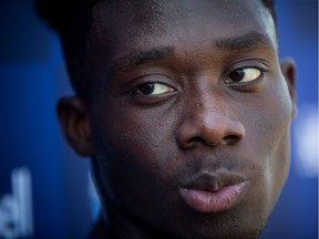 Vancouver Whitecaps midfielder Alphonso Davies pauses during a news conference at the MLS soccer team's training facility in Vancouver, on Thursday July 26, 2018. The Vancouver Whitecaps confirmed Wednesday that German soccer giant Bayern Munich has agreed to a transfer deal for the 17-year-old Canadian, in a move that according to the team could amount to more than $22 million US, the most ever received by an MLS club. Bayern said Davies' contract runs until 2023.
