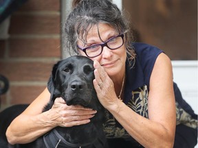 East Windsor resident Mary Dibbley and her Labrador Retriever, Stella, on July 20, 2018 - one day after an attack by loose dogs that Dibbley describes as pit bulls.