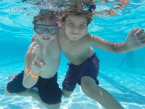 Caden Rubinski and Ethan Huluk enjoy Lanspeary Pool in this file photo from 2014.
