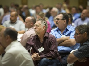 Representatives of local manufacturers listen attentively during a luncheon hosted at the Ciociaro Club on July, 17, 2018, by the Canadian Association of Mold Makers and dealing with the changing rules on U.S. tariffs that threaten local tool and die, mould-making and autoparts sectors.