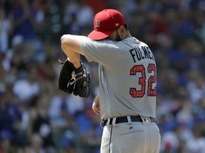 Detroit Tigers starting pitcher Michael Fulmer wipes the sweat from his face during the fifth inning of a baseball game against the Chicago Cubs, Tuesday, July 3, 2018, in Chicago.