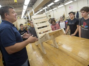 Construction teacher Trent Durocher instructs  students involved in a summer skilled trades camp at Herman Academy on July 9, 2018.
