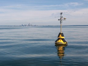 A weather information collected buoy is seen off the shore of Cleveland in Lake Erie. A simple text message to the buoy will get you life weather data.