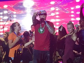 Vanilla Ice urges the crowd to dance for the climax of the "Back to the 90s" lineup on the final night of this year's Bluesfest Windsor, July 15, 2018.