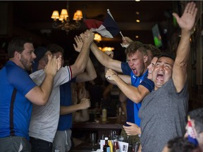 French supporters celebrate at the Manchester after a goal by France as they defeat Croatia 4-2 to win the World Cup, Sunday, July 15, 2018.
