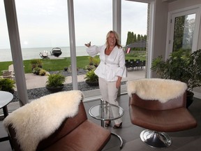 Three times better than a million-dollar view! Listing agent Terri Hughes shows the expansive view of Lake St. Clair from the waterfront side of this Tecumseh home at 14046 Riverside Drive on Aug. 1, 2018. The property is yours for a cool $2,995,000.