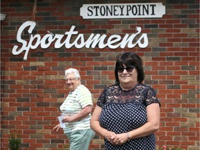 Stoney Point Sportsmen's Club event co-ordinator Yvette Tremblay, right, shown on Aug. 2, 2018, has witnessed a rebound in the financial health of the community club located on Lake St. Clair. Behind her, member Bertha Breault heads to the entrance.