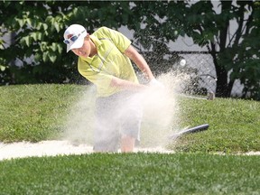 Tecumseh, Ontario.  August 13, 2018.  Derick Hare of St. Clair College blasts from the sand on the 295-yard, 13th hole Beach Grove Golf and Curling Club during final tournament of the Jamieson Junior Golf Tour August 13, 2018.  (NICK BRANCACCIO/Windsor Star).