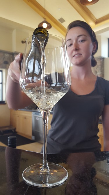 Joslyn Sharp, sales associate and wine taster at Viewpoint Estate Winery, pours a sampling of the establishment’s finest vintage for our tasting.