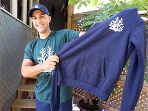 Mitch Dender models his For The Reef clothing line on Aug.  24, 2018. A portion of sales goes to planting coral in the oceans.