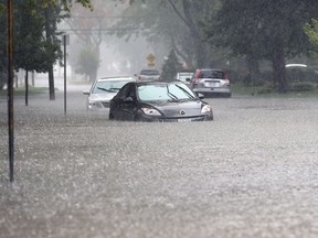 Vehicles are shown abandoned in the water near Wyandotte Street East in Riverside on Aug. 29, 2017, following heavy rainfall that triggered flooding in the area.