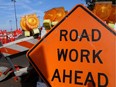 A road construction sign and barricades are shown in this photo illustration.