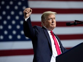 In this July 31, 2018, file photo, President Donald Trump speaks at a Florida campaign rally in Tampa.