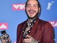 U.S. rapper Post Malone holds his award for song of the year at the 2018 MTV Video Music Awards at Radio City Music Hall on August 20, 2018 in New York City.