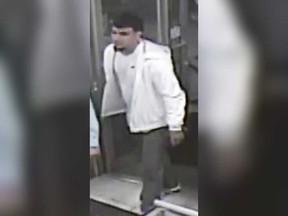 A security camera image of the last unidentified suspect still sought by Windsor police in relation to a group assault incident that smashed the glass of the downtown Pizza Pizza location on May 26, 2018.