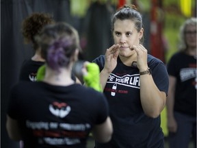 Melinda Watpol instructs students attending Shape Your Life, a non-contact boxing program for women who have experienced violence, at Kersey Kickboxing, Wednesday, Aug. 29, 2018.