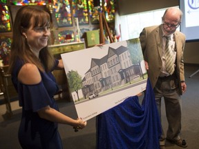 Shelley Bolger, left, general manager of Canterbury College, and Dr. Gordon Drake, principal of the college, unveil the plans for a new three-storey residence, Wednesday, August 29, 2018.  The building, which will increase capacity to nearly 180 students, is set to open for September 2019.
