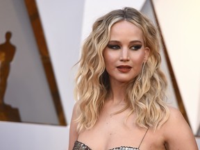 FILE - In this March 4, 2018 file photo, Jennifer Lawrence arrives at the Oscars at the Dolby Theatre in Los Angeles. A Connecticut man is asking for leniency while facing sentencing for hacking into more than 250 iCloud accounts of Hollywood stars and other people. George Garofano, of North Branford, was one of four men arrested in the 2014 hacking scandal that led to private photos of Lawrence, Kirsten Dunst, Kate Upton and others being made public. Sentencing is scheduled for Aug. 29,  in federal court in Bridgeport.
