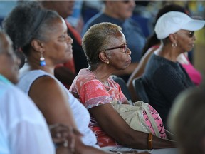 Attendees at the Windsor Emancipation Celebration, which featured award-winning poet and playwright George Elliott Clarke, listen in at Lanspeary Park on Aug. 4, 2018.