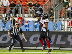 Toronto Argonauts wide receiver Armanti Edwards (10) makes a touchdown catch over Ottawa Redblacks defensive back Corey Tindal (28) to put the Argos in the lead in the final seconds of fourth-quarter CFL action in Toronto on Aug. 2, 2018.