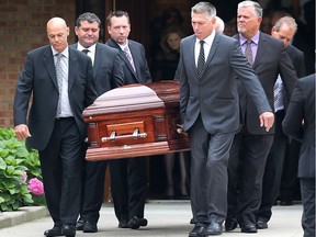 Pallbearers carry the casket of Mark Boscariol after funeral services at Our Lady Of Mount Carmel Church in Windsor on Aug. 1, 2018.
